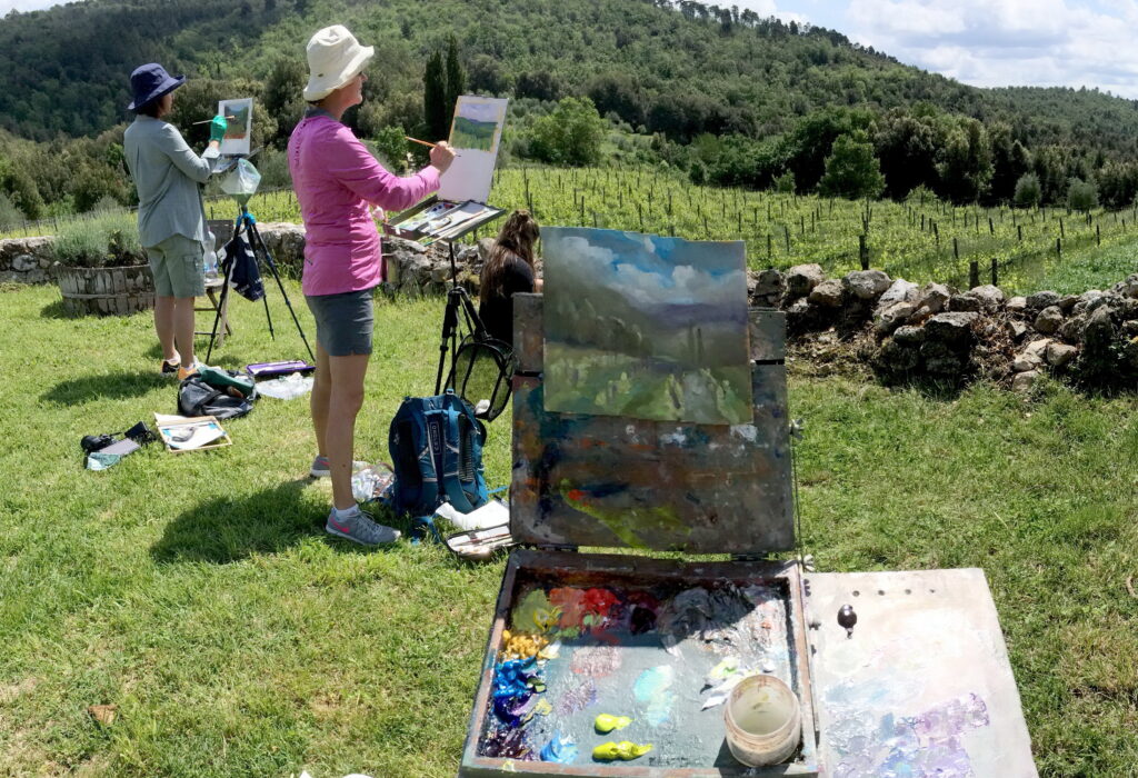 Women painting en plein air in Tuscany