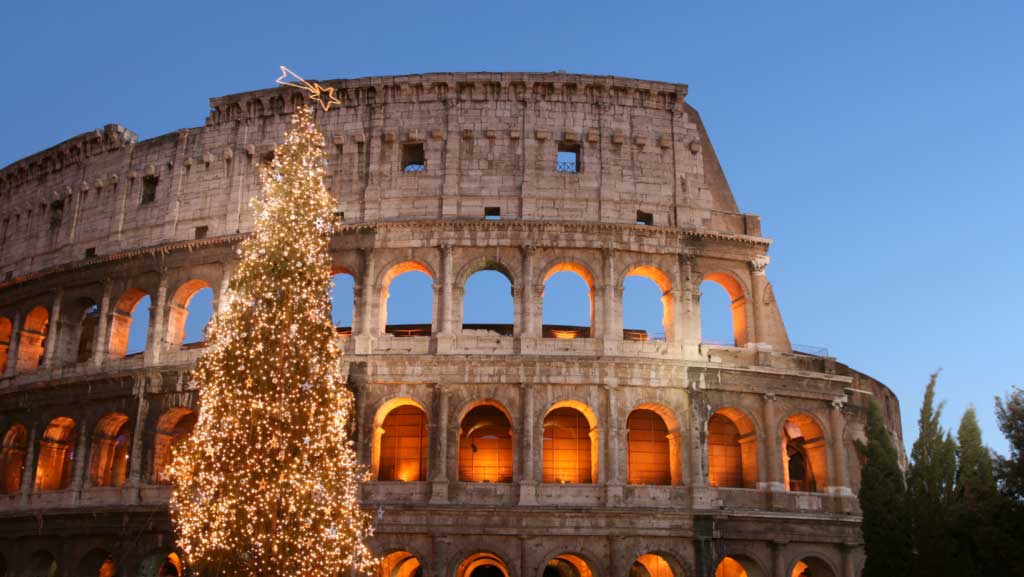 Illuminated Christmas tree outside the Colosseum in Rome, Italy