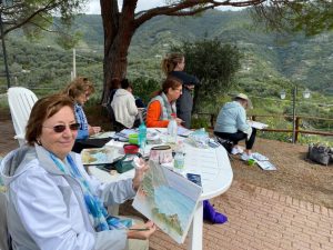 Students attending artist Jan Guarino's class in Italy