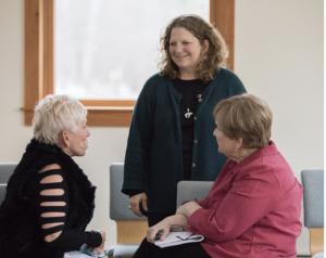 Jennifer Browdy smiling with others in her writing course held in Italy